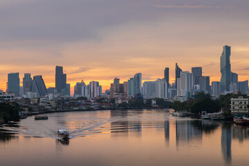 Wall Mural - Bangkok city center financial business district, waterfront cityscape and Chao Phraya River during twilight before sunrise, Thailand