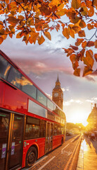 Fototapete - Big Ben against colorful sunset with red bus during autumn in London, England
