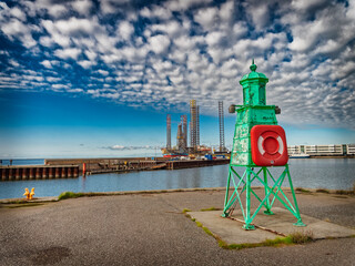 Wall Mural - Retro lighthouse at the entrance to Esbjerg harbor, Denmark