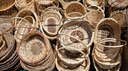 Wall Mural - Empty wicker baskets for sale in a market place