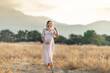 © Алина Битта - beautiful happy pregnant woman in the summer field nature meadow with in sunset