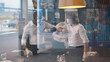 © nimito - Diverse waiters in medical mask and gloves bumping elbows while setting tables in restaurant