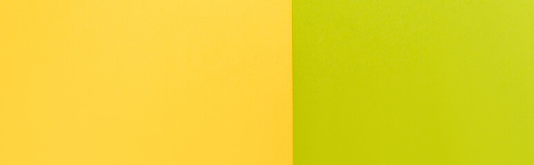 Wall Mural - top view of colorful abstract yellow and green paper background, panoramic shot