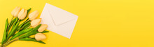 Top View Of Envelope Near Tulips On Yellow Background, Panoramic Shot