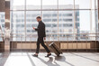© zinkevych - Man walking through the airport with the luggage