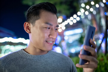 Poster - asian man use phone outdoor