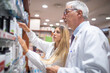 © Minerva Studio - Pharmacists checking their inventory in their pharmacy