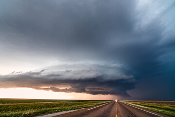 Wall Mural - supercell storm clouds over a road