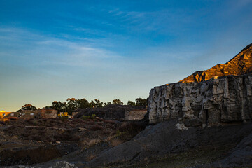 Coal mountain rubble cut with trees in the background