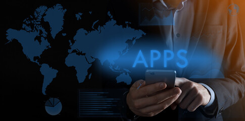 Businessman holding a smartphone with inscription APPS ,background at night,concept futuristic Business, Technology, Internet and network concept