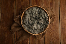 Newborn Photography Digital Background Prop. Wood Basket With Green Fur And On A Wooden Background