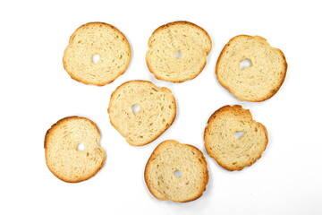 Round bread slices. Bake rolls. Mini bread chips isolated on white background. Round bread slices.