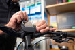 © mmphoto - Bike mechanic maintains an e-bike