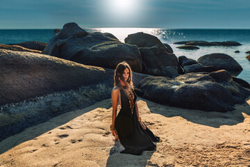 Wall Mural - beautiful young stylish woman outdoor at sunset