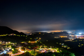 Sticker - Jiufen village at night with mountain and ocrean view.