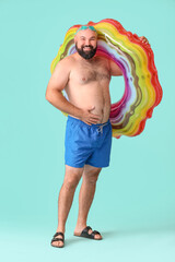 Sticker - Overweight man with inflatable ring on color background