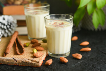 Wall Mural - Kesar Badam milk shake or Almond Saffron milk prepared with almonds, spices and milk Kerala India. Kheer or North Indian traditional health drink Flavoured milk   badam lassi served with dry fruit