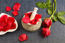 Rose Water With Rose Petals Indian Red Rose Flower.  Making Organic Rose Essence For Cooking  Kerala India.  Essential Oil Aromatherapy Skincare, Spa Relaxation, Treatment, Organic Cosmetics Concept.