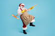 © deagreez - Full length body size view of his he nice attractive glad cheerful Santa cleansing floor doing domestic housework playing mop like guitar isolated bright vivid shine vibrant blue color background