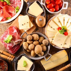 Wall Mural - raclette cheese with meats and potato