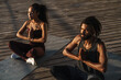 © Drobot Dean - Calm afro american couple doing yoga exercises