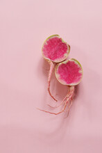 Fresh Watermelon Radishes On A Pink Surface