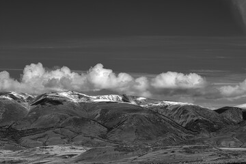 panoramic view of picturesque snowy mountains tops on blue sky background