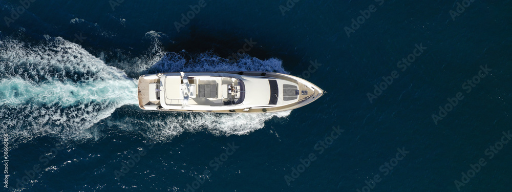 Aerial drone ultra wide photo of luxury yacht with wooden deck cruising in Aegean deep blue sea - obrazy, fototapety, plakaty 