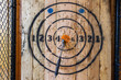 Axe throwing target with axe in center on bullseye