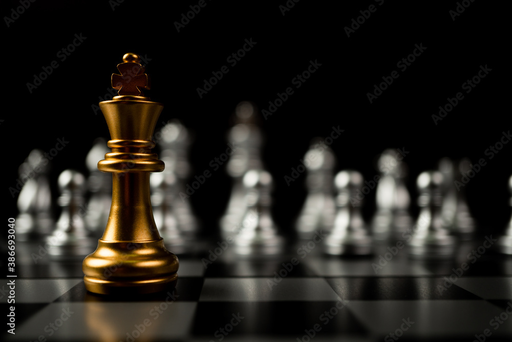 Golden King chess standing in front of other chess, Concept of a leader must have courage and challenge in the competition, leadership and business vision for a win in business games - obrazy, fototapety, plakaty 