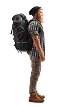 Full Length Profile Shot Of A Bearded Guy Hiker With A Backpack