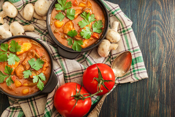 Wall Mural - Stew soup with meat, potatoes, mushrooms and red pepper