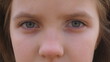 © olehslepchenko - Close up blue eyes of unhappy little blonde girl blinking and looking into camera with a despairing sight. Sorrowful gaze of small depressed child. Facial expression of disappointing female kid
