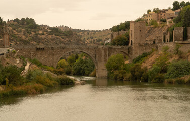 MEDIEVAL BRIDGE OVER THE TAJO RIVER IN TOLEDO, IMPERIAL CITY