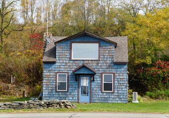 A small blue house surrounded by fall foliage near Wyalusing, Pennsylvania, U.S