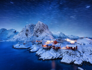 Wall Mural - milky way and stars trails. view on the house in the hamnoy village, lofoten islands, norway. landsc
