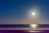 Fototapeta Morze - Moonrise over the Atlantic
