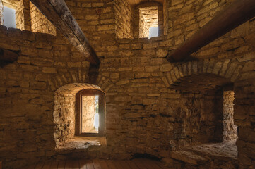 Interior of the old fortress tower. The window embrasures, thick walls.