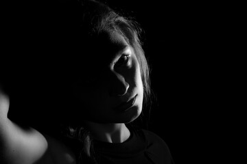  Black and white portrait of an Italian young woman on black background