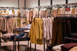 © Galina Atroshchenko - Sale of clothes in a shopping center.
