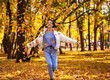 © Andrey_Arkusha - Happy young girl running in the autumn park