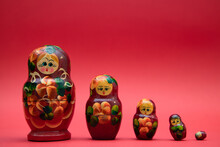 A Set Of Wooden Matryoshka Dolls On Warm Background