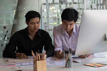 Close-up view of young ui development team working together in office