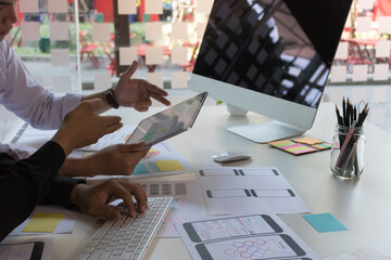 Close-up view of young ui development team working together in office