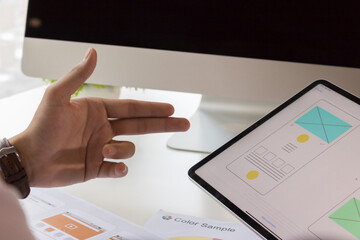 Close-up view of young ui development team working together in office