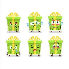 Sticker - Green christmas gift cartoon character with sad expression