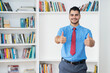 © Daniel Ernst - Mexican hipster businessman with tie showing thumbs up