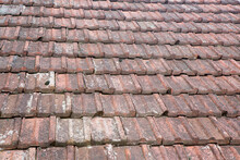 The Roof Is Made Of Old Vintage Ceramic Tiles. The Texture Of The Background Details.