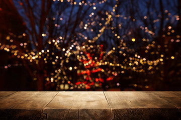 Empty table in front of christmas lights background. For product display montage