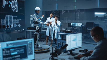 Poster - In Robotics Development Laboratory: Engineers and Scientists Work on a Bionics Exoskeleton Prototype with Person Testing it. Designing Wearable Exosuit to Help Disabled People, Hard Labor Workers
